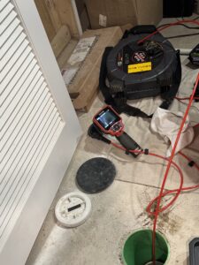 Sewer camera inspection equipment inspecting a sewer line
